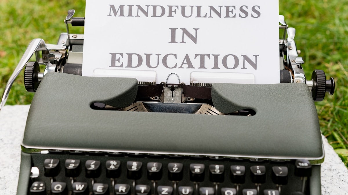 an old typewriter with a sign that says mindfulness in education